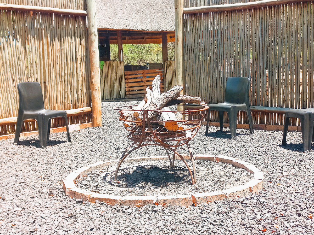 Outdoor kitchen boma with fire place