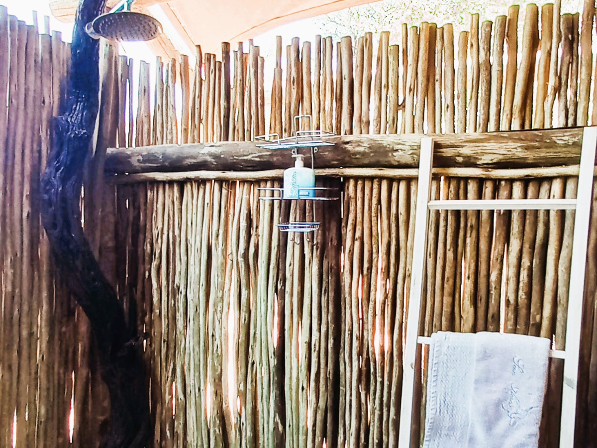 Luxury Safari Tent semi-outdoor bathroom under the stars